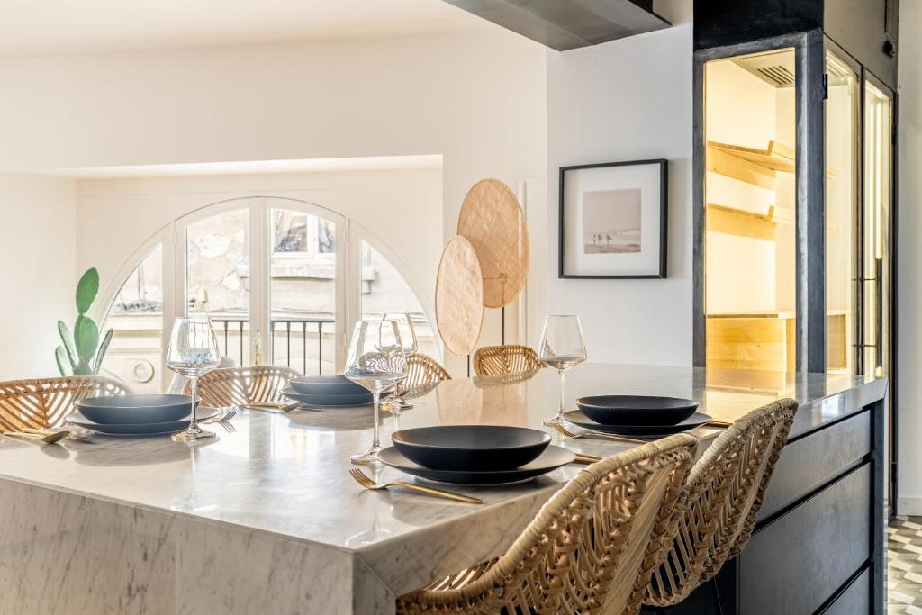 Dining — marble counter set for dinner, wine glasses