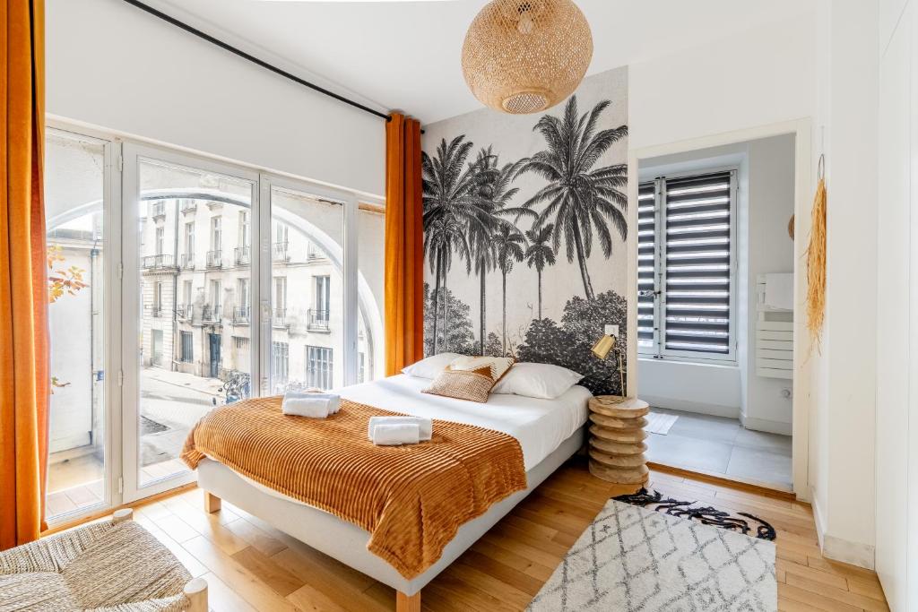 Bedroom 1 — palm mural, arched window, street view