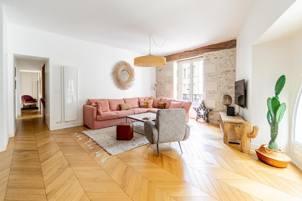 Living room — alternate angle, cactus, arched window